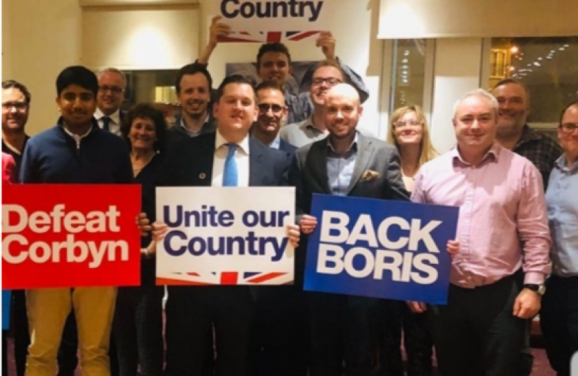 Louie (centre) pictured alongside local members at the Woodcroft Club, Eltham