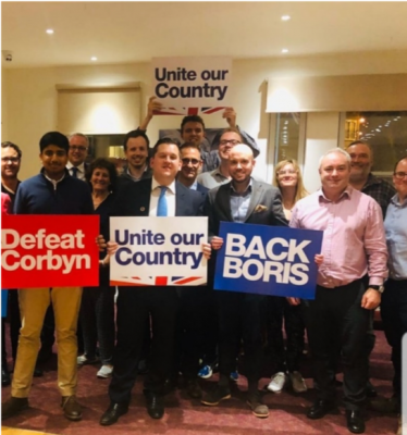 Louie (centre) pictured alongside local members at the Woodcroft Club, Eltham