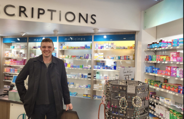 Charlie Davis in a pharmacy