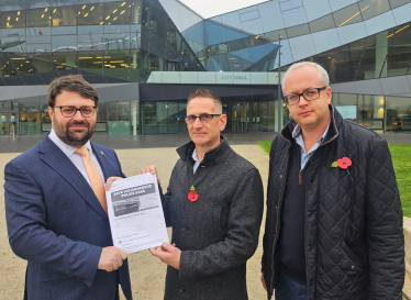 Roger Tester and Matt Hartley handing in the Save Coldharbour Police Base petition with Thomas Turrell AM